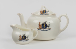 ROYAL DOULTON antique English porcelain teapot and creamer decorated with the Hobart coat of arms and motto "SIC FORTIS HOBARTIA CREVIT", circa 1910s, black factory mark to base "Royal Doulton, England, Taylor & Sharp, Hobart", the teapot 13cm high, 20cm wide