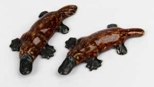 NELL & ROBERT McCREDIE pair of Australian pottery platypus ornaments, incised "McCredie, N.S.W.", 11cm and 12cm long