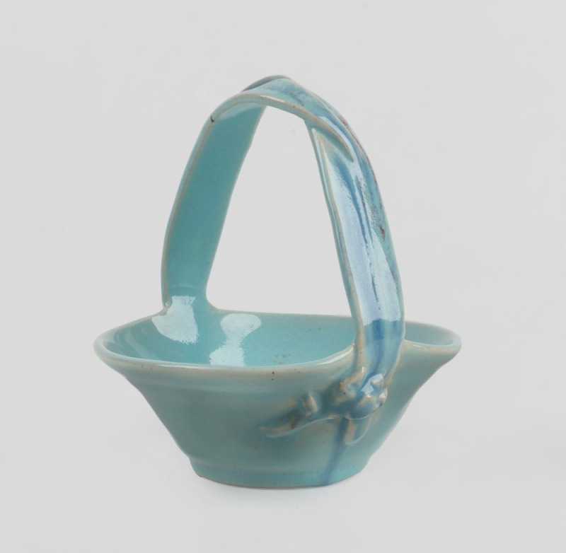 NELL HOLDEN blue glazed pottery basket with applied gumnuts and leaves, incised "Nell Holden" with gum leaf mark, 9.5cm high