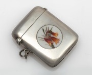 An antique sterling silver vesta case with enamel Australian Christmas bell decoration, engraved verso "Lardy", made in Birmingham, circa 1913, 5.5cm high, 36 grams total