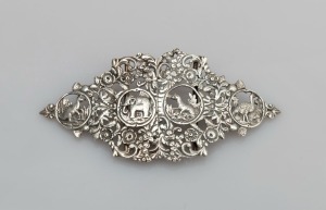 An antique sterling silver belt buckle adorned with kangaroo, emu, elephant, beaver, thistle, English rose, shamrock etc., by Samuel Jacob of London, circa 1900, 14cm wide, 69 grams