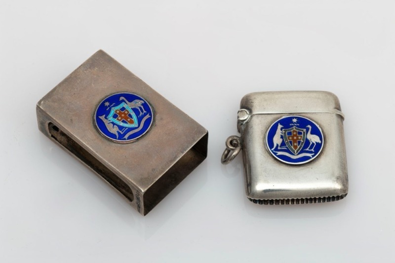 An antique Australian silver vesta and match box holder, both adorned with Australian coat of arms in blue enamel, most likely retailed by Prouds of Sydney, (2 items), stamped "STG 925" and "STG SIL", 4cm and 4.5cm high