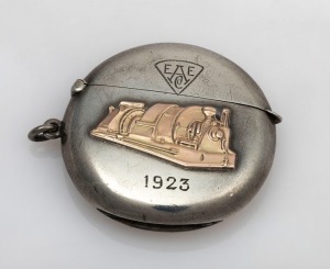 Australian silver presentation vesta with rose gold highlights, engraved "Souvenir Of The Starting Up At Ultimo Power House Of The First Turbo Alternator Built In Australia. Presented By The English Electric Company Australia Limited, March 1923", stamped "H.H.H. STG. SILVER", 5cm high, 38 grams