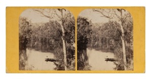EDWARD HAIGH, Stereoview card, BOAT ON YARRA RIVER, NEAR MELBOURNE, VICTORIA, (1861-1862). Stereoscopic albumen print photographs, each image approximately 78 x 70mm, flat yellow mount 83 x 175 mm; verso with printed label "6. Boat on River Yarra, near Melbourne Victoria. Ed. Haigh, Photo.", and below this in manuscript "Eg'mont. May 28- '62"; both prints, as well as the mount, are in fine condition.