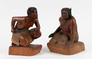 A pair of New Zealand carved and painted timber statues of kneeling Maori figures, mid 20th century, 23cm high