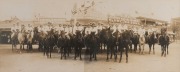 [WOMEN & WAR] A panoramic photograph of The Mounted ‘Burra Cheer Up Girls’ in Market Square, Burra, South Australia, c.1915-1918; silver gelatin panoramic print in two sections, each approx. 15 x 38cm, in mount, 27.5 x 52cm overall.