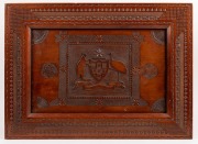 "ADVANCE AUSTRALIA" antique kauri pine panel with chip carved coat of arms and matching frame, 19th/20th century, ​​​​​​​56 x 67cm overall