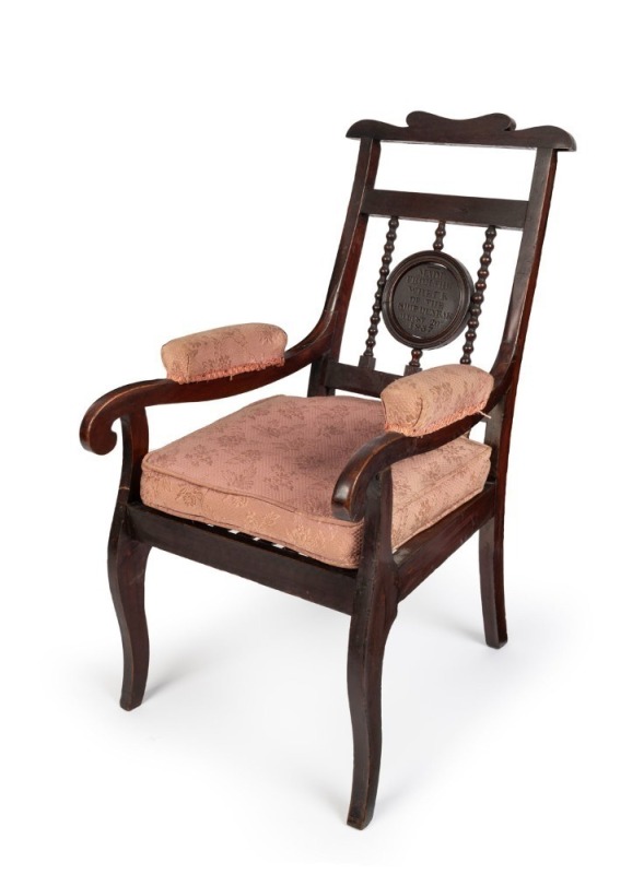 [ANDREW LENEHAN INTEREST] DUNBAR CHAIR. Antique oak armchair with engraved plaque stating "MADE FROM THE WRECK OF THE SHIP DUNBAR, AUGUST 20TH 1857". 92cm high, 52cm across the arms. The Dunbar was wrecked off Sydney Heads on the night of August 20th 1857