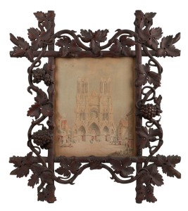 An antique Australian carved kauri pine picture frame with grape and vine motif, housing a watercolour of Notre Dame signed "H. Medleykof (?)", 19th century, 67 x 69cm, internal size 40 x 33cm