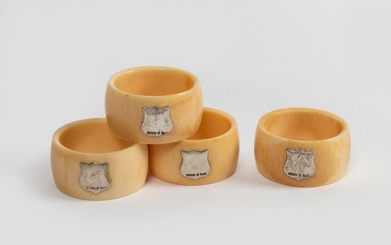 WILLIAM DRUMMOND & Co. of Melbourne set of four antique ivory napkin rings with applied Australian silver shields, early 20th century, ​​​​​​​5cm diameter, 2.5cm wide