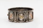 An antique silver plated bangle decorated with kookaburras and kingfisher in gold finished highlights, 19th/20th century,