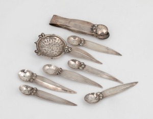 ELSIE YOUNG set of six Australian silver teaspoons, sugar tongs and matching tea strainer, all decorated with gumnuts and gum leaves, 20th century, (8 items), stamped "STG. SILVER, the strainer 12.5cm long