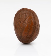 An antique carved nut vesta, finely decorated with Australian themes including kangaroos and emus, horse and rider, etc, circa 1880, 4.2cm high