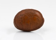 An antique carved nut vesta, finely decorated with Australian themes including kangaroos and emus, horse and rider, etc, circa 1880, 4.2cm high - 2