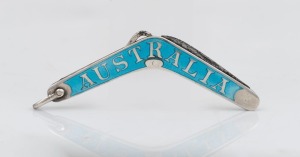 An antique sterling silver and blue enamel patriotic "AUSTRALIA" boomerang penknife with button hook, 19th/20th century, 7cm long when closed.