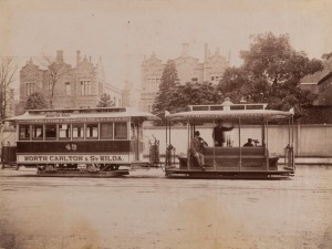 MELBOURNE STREET CARS & TRAMS: A group of three albumen paper photographs including a striking image of the North Carlton & St Kilda cable-car passing the Queen Victoria Hospital in Lonsdale Street and another view of Russell Street before paving and trams; circa 1880s-1900. All approx. 15 x 20cm. (3)