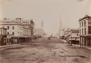 MELBOURNE STREET CARS & TRAMS: A group of three albumen paper photographs including a striking image of the North Carlton & St Kilda cable-car passing the Queen Victoria Hospital in Lonsdale Street and another view of Russell Street before paving and tram - 3