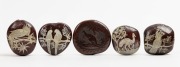 Four Australian folk art burra nut ornaments hand-painted with native parrots, cockatoo, palm cockatoo and emu; together with a carved kangaroo example, Queensland origin, 19th/20th century, (5 items), the largest 5.3cm wide