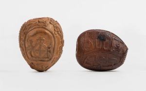 Two carved nut vestas with Australian themes, 19th century, the larger 4.5cm high