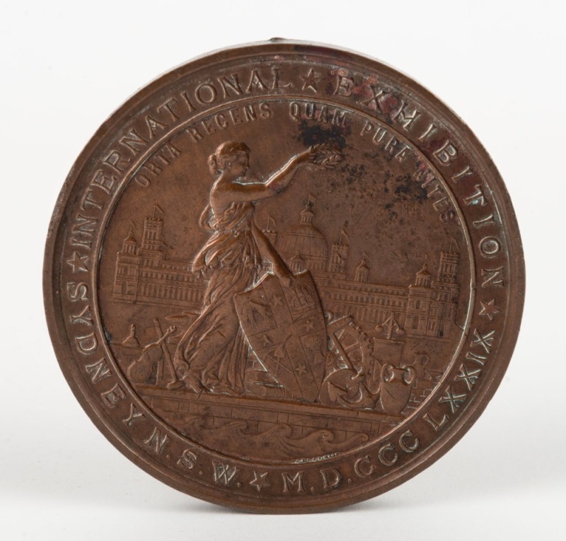 MEDAL: 1879 SYDNEY INTERNATIONAL EXHIBITION large bronze medal by Wyon (76mm), engraved on reverse to "CHARLES MALAN and T.W. STILLING 1880". Charles Malan, a long-time resident of New Caledonia is noted as an award winner for his display of Cajaput oil,