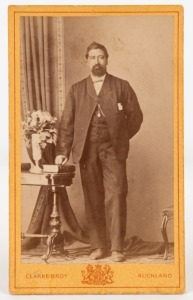 CLARKE BROTHERS, Queen St., AUCKLAND: carte-de-visite bearing an albumen paper photograph of a Maori gentleman, who appears to have been posed with his right hand on a bible, circa 1870s; overall 10 x 6cm.