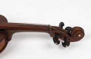 A rare antique Australian violin, hand crafted in cedar with Queensland silky oak back, and hand-made tuning pegs, 19th century, ​​​​​​​bearing pencil inscription "BENNETT MAKER", housed in a period ebonized timber coffin case, 58.5cm long - 4