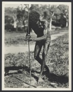 [AUSTRALIAN ABORIGINALS]. A group of photographs, various sizes and unknown photographers, circa 1900 - 1920s; including two fine studies of men making fire, fishermen hauling a giant grouper fish into their canoe, men with spears and boomerangs, a family - 2