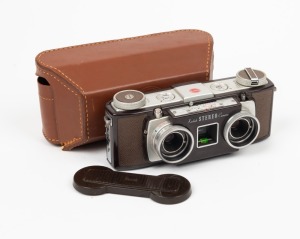 KODAK: Stereo-Kodak 35mm stereo camera, c. 1954, with twin Anaston 35mm f3.5 lenses, twin lens cap, and leather case.