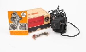 BOLEX-PAILLARD: Unimotor MC-17 camera attachment [#13938], c. 1958, by all appearances in mint condition in maker's box with various cables and instruction booklet.