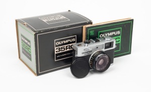 OLYMPUS: Olympus 35 RC rangefinder camera [#466719], c. 1970, with E. Zuiko 42mm f2.8 lens and lens cap. Offered in maker's box with two instruction booklets.