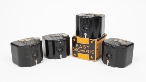 KODAK: Four c. 1930s Baby Brownie 127 film cameras in black Bakelite, one of which in maker's box. (4 cameras)