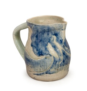 MERRIC BOYD pottery jug with hand-painted sgraffito landscape decoration, incised "Merric Boyd, 1935", 13cm high, 14cm wide