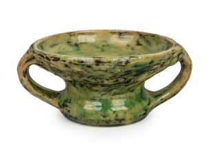 MERRIC BOYD green glazed two-handled pottery vase with windswept tree decoration, incised "Merric Boyd, 1927, Australia", 10cm high x 23cm wide