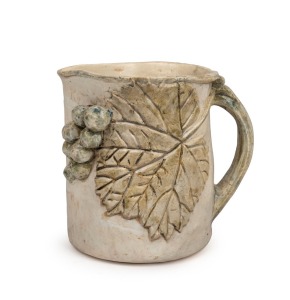 MERRIC BOYD cream glazed pottery jug with applied grapes and leaf, incised "Merric Boyd, 1941", 15.5cm high