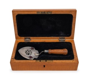 TASMANIAN ARTS & CRAFTS SOCIETY: Australian sterling silver presentation trowel inlaid with cabochon garnets and casuarina​​​​​​​ handle, housed in a bespoke fiddleback maple plus fitted box, inscribed: "Presented to J. Duncan Esq. President. C. T. A. Tas