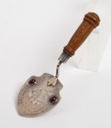 TASMANIAN ARTS & CRAFTS SOCIETY: Australian sterling silver presentation trowel inlaid with cabochon garnets and casuarina​​​​​​​&nbsp;handle, housed in a bespoke fiddleback maple plus fitted box, inscribed: "Presented to J. Duncan Esq. President. C. T. A. Tas - 2