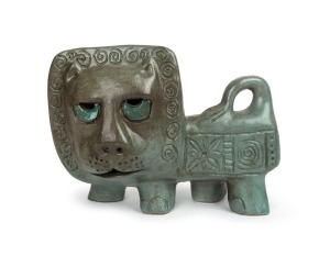 McLAREN green glazed pottery lion, incised "McLAREN", 19cm high, 25cm long