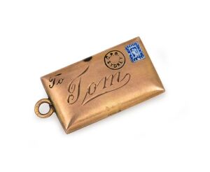 BOER WAR INTEREST: 9ct gold charm in the form of an envelope with enamel decoration, engraved "TOM".