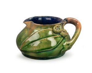 RUMUED green glazed pottery jug with applied gumnuts and leaf with branch handle, incised "Remued, Hand Made, 173S", 6.5cm high, 12.5cm wide