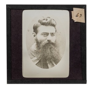 An original glass magic lantern slide of NED KELLY; Charles Nettleton's portrait of Kelly taken the day before his execution on 11th November 1880. The slide maker is unknown, but probably J. Searle of Melbourne; 1890s, 85 x 82mm.