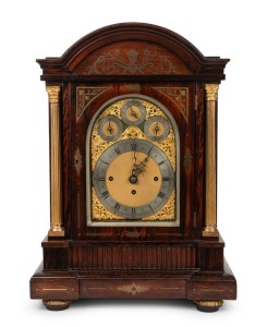 An impressive antique English table clock in rosewood veneered brass inlaid case in the Regency style with gilt Corinthian columns and sunburst arched sound frets to the sides. Substantial three train chain fusee movement, chiming the quarters on eight bells and striking the hours on a coiled gong. Three subsidiaries to the gilt arched dial, CHIME/SILENT, REGULATION, and EIGHT BELLS/WESTMINSTER, late 19th century, 64cm high, 46cm wide, 30cm deep