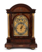 An impressive antique English table clock in rosewood veneered brass inlaid case in the Regency style with gilt Corinthian columns&nbsp;and sunburst arched sound frets to the sides. Substantial&nbsp;three train chain fusee movement, chiming the quarters on eight be