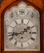 An antique English Gothic Revival mantle clock in carved oak case with three train fusee movement, quarter chiming on nest of nine bells, attractively engraved one-piece silvered dial with three subsidiary dials to the arch, 19th Century, an imposing 78 c - 2