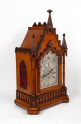 An antique English Gothic Revival mantle clock in carved oak case with three train fusee movement, quarter chiming on nest of nine bells, attractively engraved one-piece silvered dial with three subsidiary dials to the arch, 19th Century, an imposing 78 c - 3