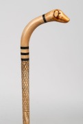 An antique walking stick with whale's tooth and baleen handle carved in the form of a dog's head, on a turned whalebone shaft, 19th century, ​​​​​​​93cm high - 2