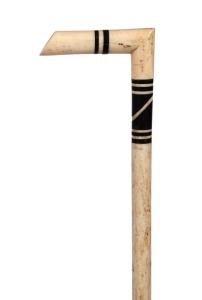 An antique walking stick with marine ivory and timber handle on a whalebone shaft, 19th century, 92cm high