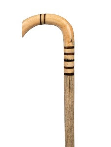 An antique walking stick with whale's tooth handle, baleen spacers and whalebone shaft, 19th century, 88cm high