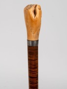 An antique walking stick with carved fist whale's tooth handle, silver collar, on a fiddleback blackwood shaft with metal ferrule,&nbsp;19th century, 93cm high - 2