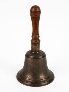 An antique brass bell with round wooden handle, 19th century, 33cm high, 18cm diameter