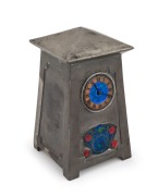 ARCHIBALD&nbsp;KNOX (1864 - 1933) English Arts & Crafts pewter and enamel case table clock with original key, most likely retailed by Liberty & Co. of London, stamped "English Pewter, 0629, Made in England", 18cm high